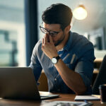 Man looking tired at work from sleep apnoea